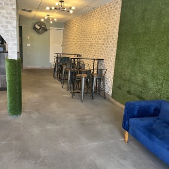 Frontera Churros - a living room with a blue couch - Sandwiches Near Me - El Paso, Texas Frontera Churros - a living room with a blue couch - Sandwiches Near Me - El Paso, Texas