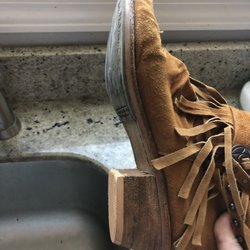 Famous Shoe Repair - Fresh new heel on that there boot, though I'm curious why it's not black?