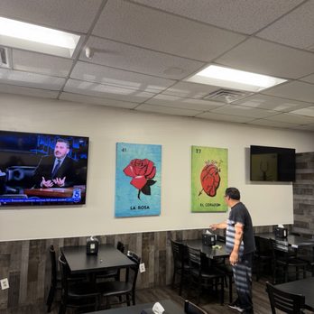 Tacos El Gordo - Dining area with wall art - Mexican Near Me - Pacoima, California Tacos El Gordo - Dining area with wall art - Mexican Near Me - Pacoima, California