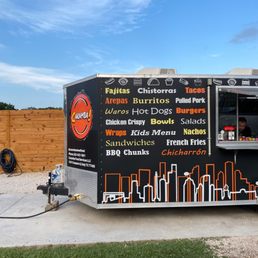 a food truck parked on the side of the road