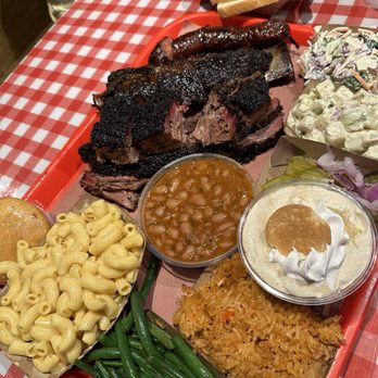 Terry Black's Barbecue - Brisket, beef rib, sausage, baked beans, banana pudding, rice, green beans, mac and cheese, potato salad . Free white breaddd - Barbeque Near Me - Austin, Texas Terry Black's Barbecue - Brisket, beef rib, sausage, baked beans, banana pudding, rice, green beans, mac and cheese, potato salad . Free white breaddd - Barbeque Near Me - Austin, Texas