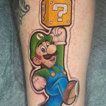 Magic Cobra Park Slope - Luigi sticker tattoo. Notice how the shoe looks like the sticker is peeling off. Done by Oogie. - Tattoo Near Me - Brooklyn, New York Magic Cobra Park Slope - Luigi sticker tattoo. Notice how the shoe looks like the sticker is peeling off. Done by Oogie. - Tattoo Near Me - Brooklyn, New York