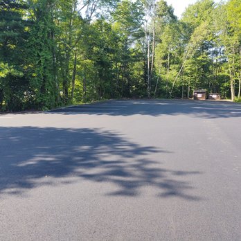 Airoldi's Paving - an empty road with trees in the background - General Contractors Near Me