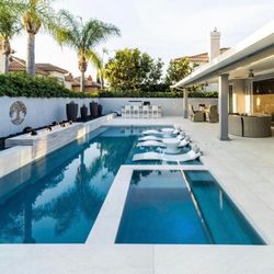 Pools by W - Spa and pool view with deck