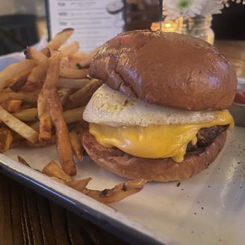 The Flying Cock - Cheeseburger with extra cheese and an over easy egg with some fries! Delicious! - Pubs Near Me - New York, New York The Flying Cock - Cheeseburger with extra cheese and an over easy egg with some fries! Delicious! - Pubs Near Me - New York, New York