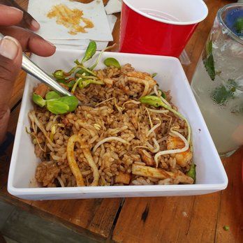 Las Tostadillas - Shrimp and calamari fried rice. I poured the shrimp broth shot in it for more flavor - Fish & Chips Near Me - Cancún, ROO Las Tostadillas - Shrimp and calamari fried rice. I poured the shrimp broth shot in it for more flavor - Fish & Chips Near Me - Cancún, ROO