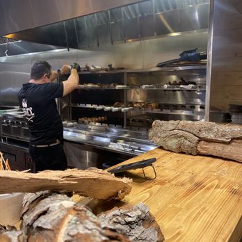 Super Arepa - a man working in a commercial kitchen - Venezuelan Near Me - Pembroke Pines, Florida