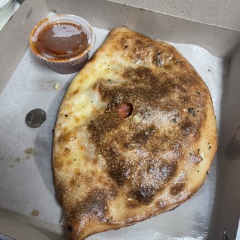 I love New York Pizza - Pepperoni Calzone with tomato, spinach, and garlic. Quarter pictured for size - Pizza Near Me - Jasper, Georgia I love New York Pizza - Pepperoni Calzone with tomato, spinach, and garlic. Quarter pictured for size - Pizza Near Me - Jasper, Georgia