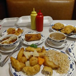 Egg roll, won ton soup, house special egg foo young, and sweet and sour triple delight