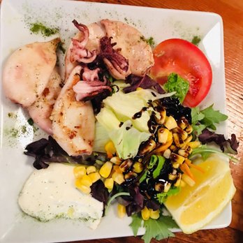 El Sur - Grilled squid salad - Tapas Bars Near Me - Madrid, M El Sur - Grilled squid salad - Tapas Bars Near Me - Madrid, M