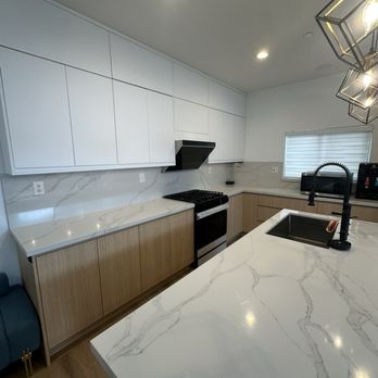 Perfect Precision Home Designs - Custom European Vicenza Oak kitchen cabinets with a Calacatta Quartz finish - Cabinetry Near Me Perfect Precision Home Designs - Custom European Vicenza Oak kitchen cabinets with a Calacatta Quartz finish - Cabinetry Near Me