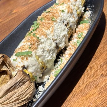 Dos Olivos Market - Caesar street corn. We cut it off the cob and mixed it up to serve. Was very good. - Specialty Food Near Me - Buda, Texas
