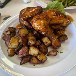 The Wild Rooster - Combo meal 1/2 chicken Potatoes