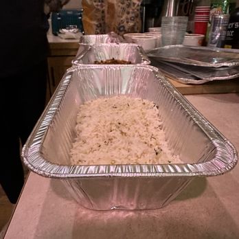 QDOBA Mexican Eats - a pan of rice - Mexican Near Me - Hayden, Idaho