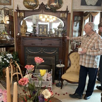 The Dempsey Manor - Men's parlor with Jim talking about the overmantle of the fireplace - Bed & Breakfast Near Me - Manistee, Michigan