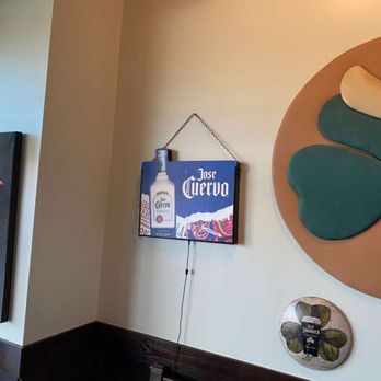 Carlos O'Brien's Mexican Restaurant - Left side of entry with lady picture saying "Hola" and a BIG three leaf clover - Mexican Near Me - Phoenix, Arizona