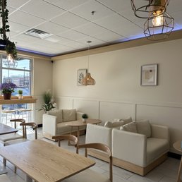 a living room with a table and chairs