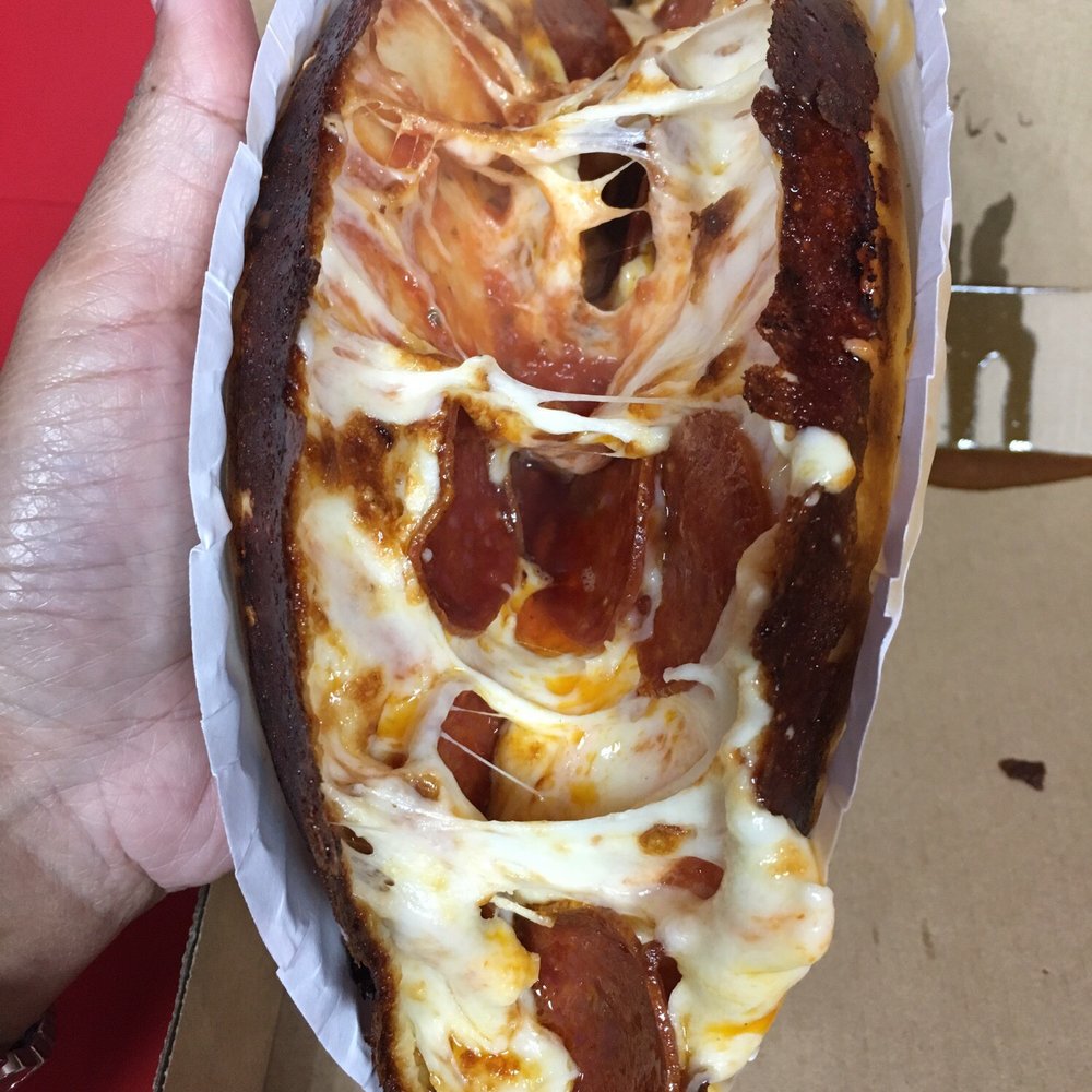 Pa'Comer Cuban Pizza - A peak inside the folded pizza - Pizza Near Me - Hialeah, Florida Pa'Comer Cuban Pizza - A peak inside the folded pizza - Pizza Near Me - Hialeah, Florida