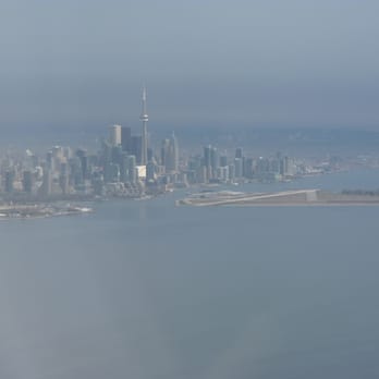 Porter Airlines - Beautiful city and airport in the foreground - Airlines Near Me - Toronto, Ontario