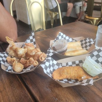 Estrellita - Fried chicken skins, empendada, and egg rolls their version. And my wife's elbow! We didn't order that! - Filipino Near Me - Atlanta, Georgia