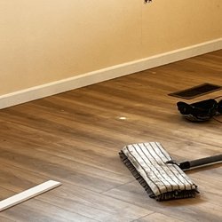 JR Flooring - Living Room Eagle Trace Water Resistant being layed by JR & Josie's Crew