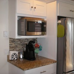 John McCaslin Plumbing & Heating - New appliances, and that's a subway tile backsplash.