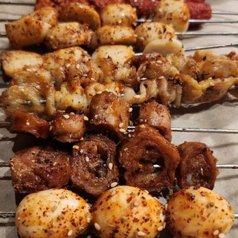 Volcano Skewer House - From top to bottom Empire sausage Fish ball Chicken skin Pork intestine Quail egg - Barbeque Near Me - Honolulu, Hawaii Volcano Skewer House - From top to bottom Empire sausage Fish ball Chicken skin Pork intestine Quail egg - Barbeque Near Me - Honolulu, Hawaii