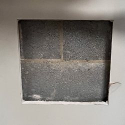 Fred Weston Plumbing - The square hole in my garage wall