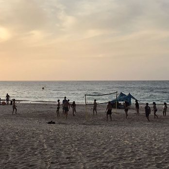 Flamenco Beach - Volleyball game at sunset. - Beaches Near Me
