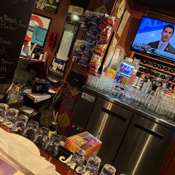 The George - a bar with wine glasses and a television - American Near Me - Vail, Colorado The George - a bar with wine glasses and a television - American Near Me - Vail, Colorado
