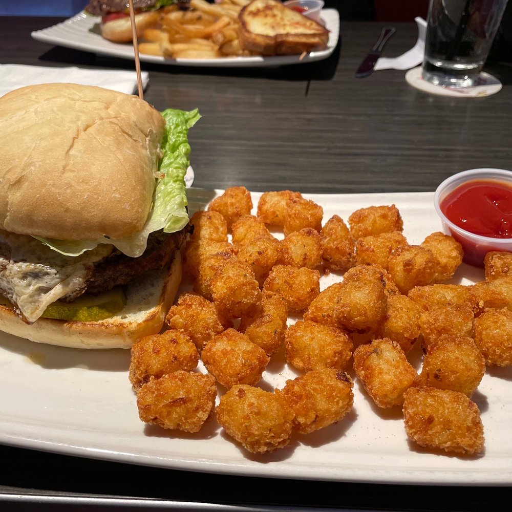 Jimmy D's District - Burger with ciabatta bun and tots. - American Near Me - Arlington Heights, Illinois Jimmy D's District - Burger with ciabatta bun and tots. - American Near Me - Arlington Heights, Illinois
