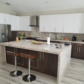 Brown Aand White Cabinets With A Waterfall Countertop Yelp