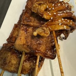 tofu skewers (x2), bbq squid tentacle skewer (x1)