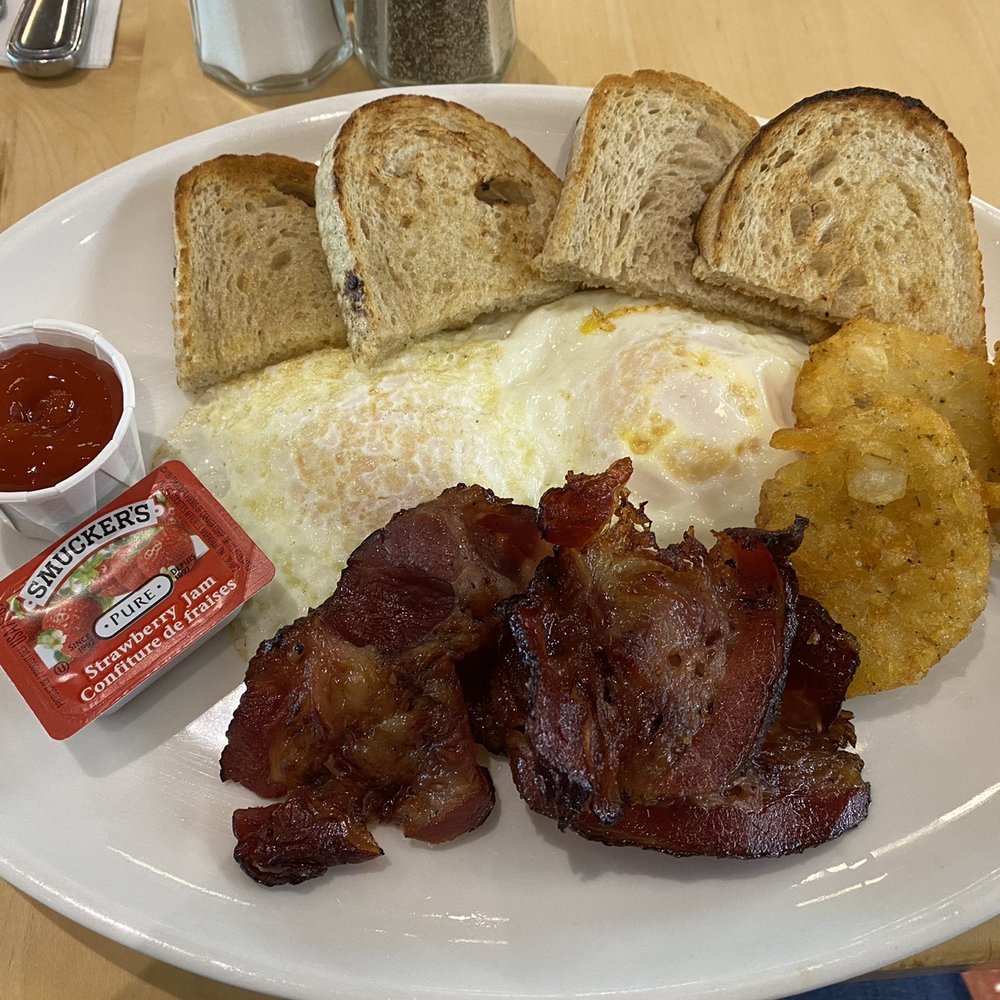 Caplansky's bacon with eggs over easy, hash browns and toast. Caplansky's bacon with eggs over easy, hash browns and toast.