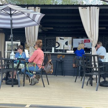 The Feed Sack - Outside bar, in  nice weather they have fans on the weekend and also a good place to watch sports as there is also a large interior bar - American Near Me - Aiken, South Carolina