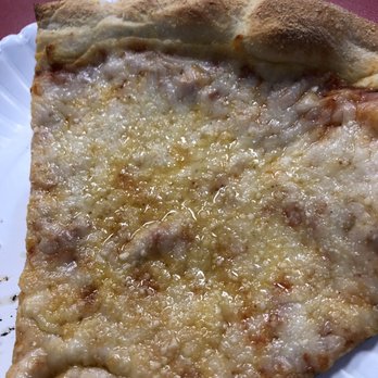 Niki's Pizza - Slice almost as big as the plate. - Pizza Near Me - Austin, Texas