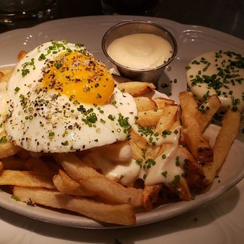 Au Cheval - Crispy fries with mornay sauce, garlic aioli, and fried egg - Bars Near Me - Chicago, Illinois