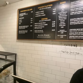 Don Pollo - Menue - A black menu board with yellow and white text lists chicken platters, salads, and side dishes at Don Pollo in Chevy Chase, MD. - Latin American Near Me - Chevy Chase, Maryland