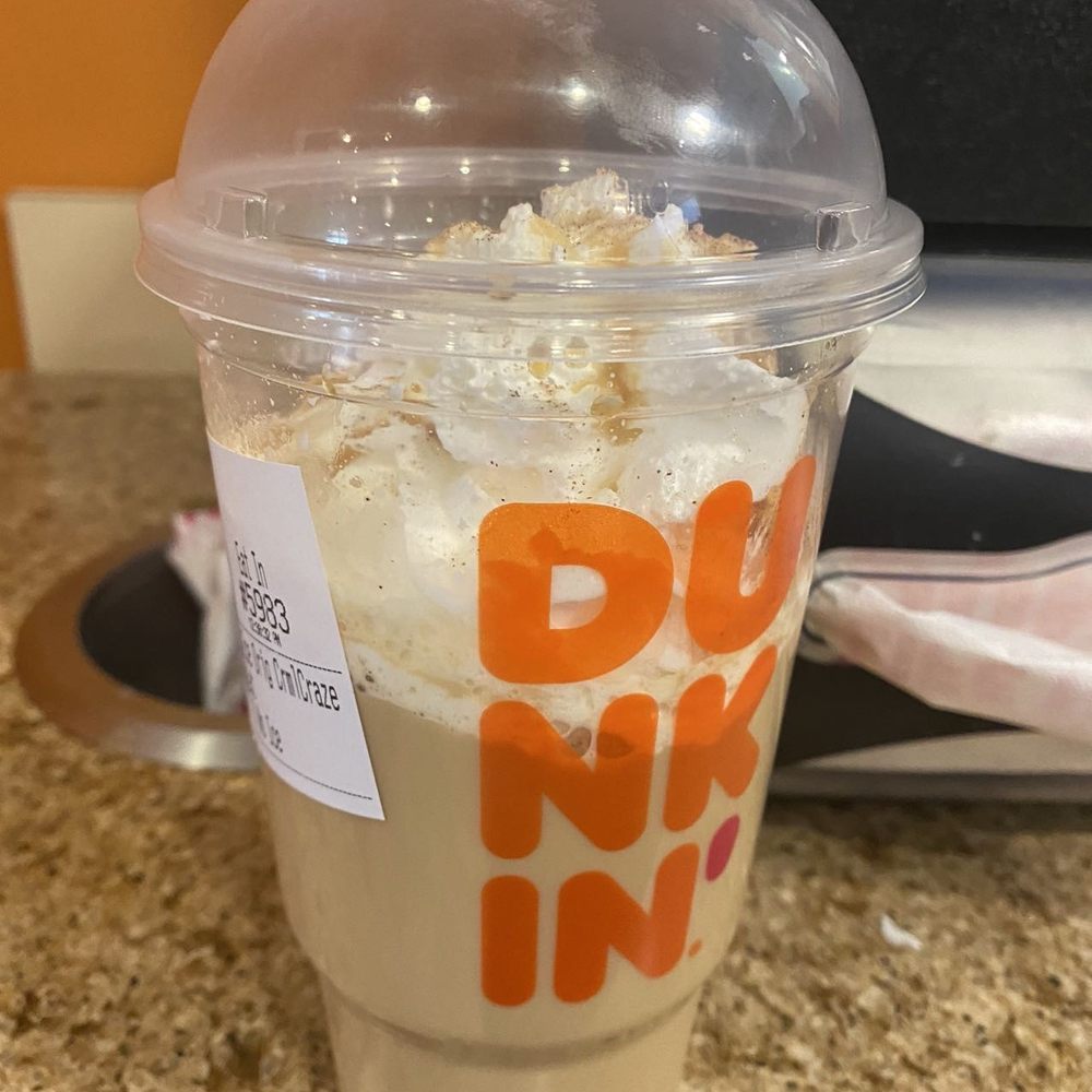 a drink in a plastic cup a drink in a plastic cup