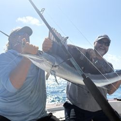 Cowboy Cowgirl SportFishing Charters - Nells n hubby with his 1st sport-fish, sailfish