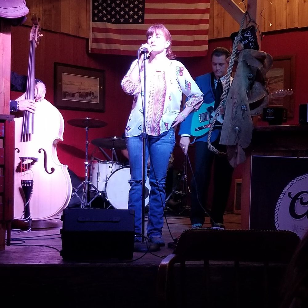 Chisholm's Saloon - a woman singing on stage - Country Dance Halls Near Me - Oklahoma City, Oklahoma Chisholm's Saloon - a woman singing on stage - Country Dance Halls Near Me - Oklahoma City, Oklahoma