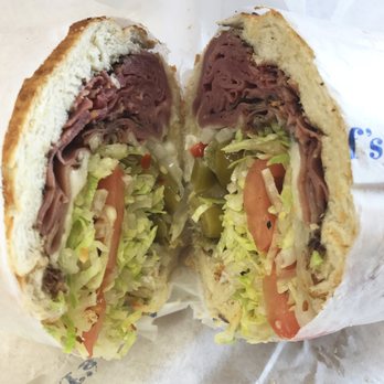 Snarf's Sandwiches - Pastrami and provolone, most of the bites were all veggies and super sour pickled peppers - Sandwiches Near Me - Austin, Texas