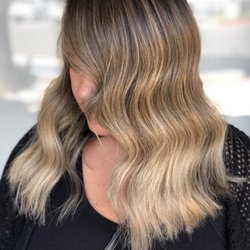 Linz DeLauder Hair Salon - Beige blonde hues create soft but noticeable pops to naturally dark hair