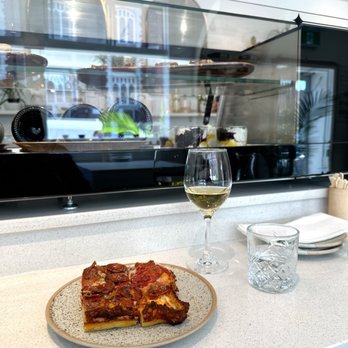 Trinity Market - a plate of pizza and a glass of wine - Wine Bars Near Me - Toronto, Ontario