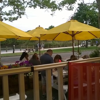 Turkuaz Grill - Outdoor seating on the deck or picnic tables overlook the Riverwalk. - Turkish Near Me - Riverhead, New York Turkuaz Grill - Outdoor seating on the deck or picnic tables overlook the Riverwalk. - Turkish Near Me - Riverhead, New York
