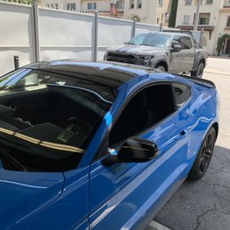 Car roof wrapped in gloss black
