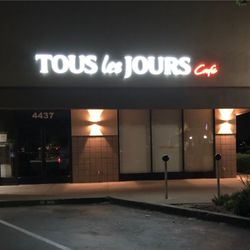 Worldwide Signs - Lit channel letters at night.