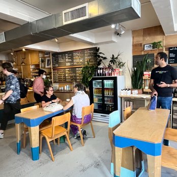 OCAFE - a group of people in a restaurant - Coffee & Tea Near Me - New York, New York