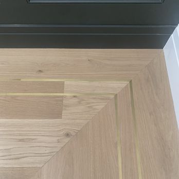 Allen Woodworking - Close up: Brass inlay
solid brushed brass installed in engineered wood flooring. - Carpenters Near Me Allen Woodworking - Close up: Brass inlay
solid brushed brass installed in engineered wood flooring. - Carpenters Near Me