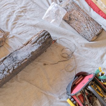 Mountain Hearth & Patio - Parts of a large gas log set during repair and cleaning. - Chimney Sweeps Near Me - Evergreen, Colorado Mountain Hearth & Patio - Parts of a large gas log set during repair and cleaning. - Chimney Sweeps Near Me - Evergreen, Colorado